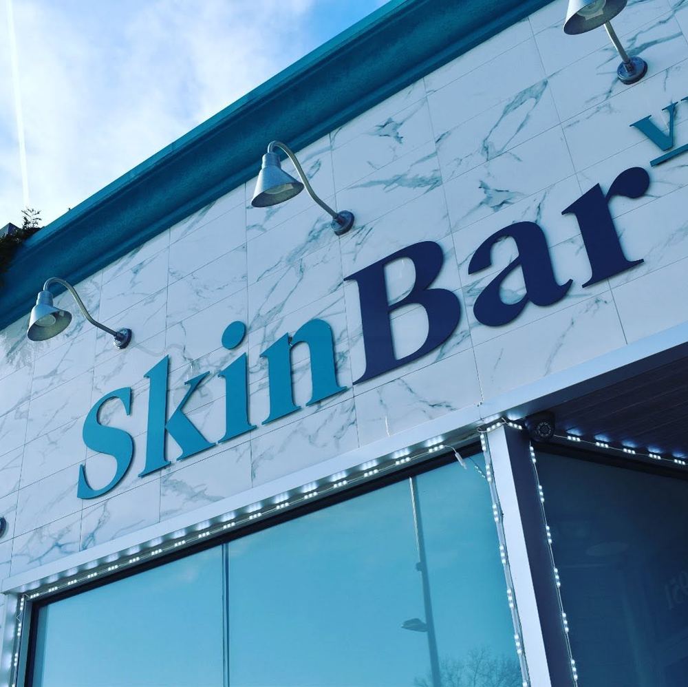 SkinBar sign above the studio entrance